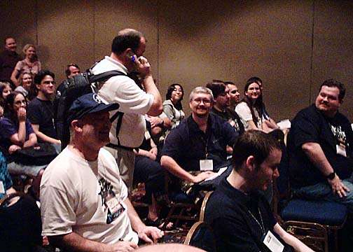 DragonLance co-author Tracy Hickman takes a call at GenCon 2004
